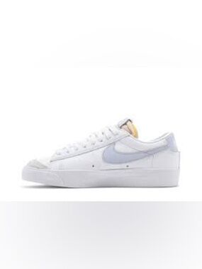 Nike White Leather Sneakers with Light Gray Swoosh and Yellow Tongue Accent